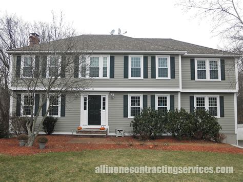 taupe siding with black shutters